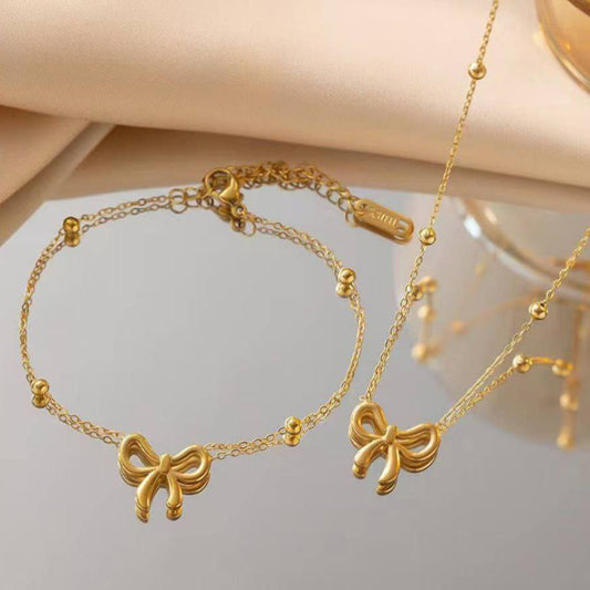 Parure Nœud Élégance – Collier & Bracelet Dorés
